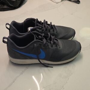 Nike Gray Sneakers with Blue Swoosh